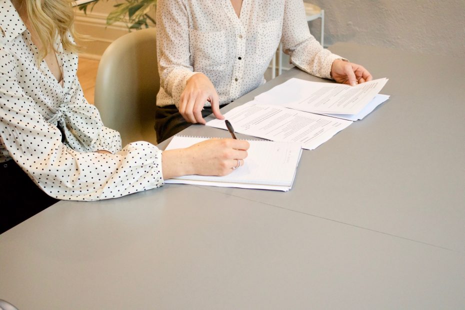 Two people working in an business environment. Image from Unsplash unsplash.com/photos/HJckKnwCXxQ